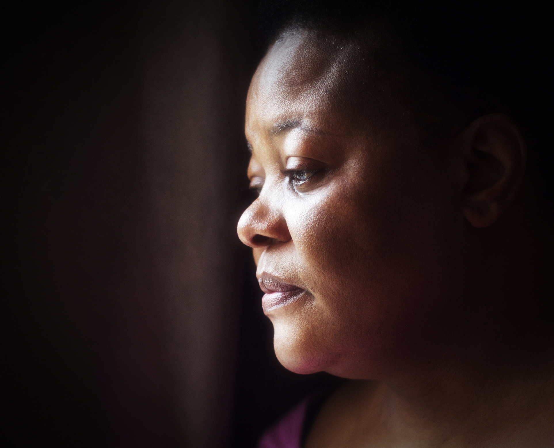 portrait of mature woman of African descent with thoughtful expression