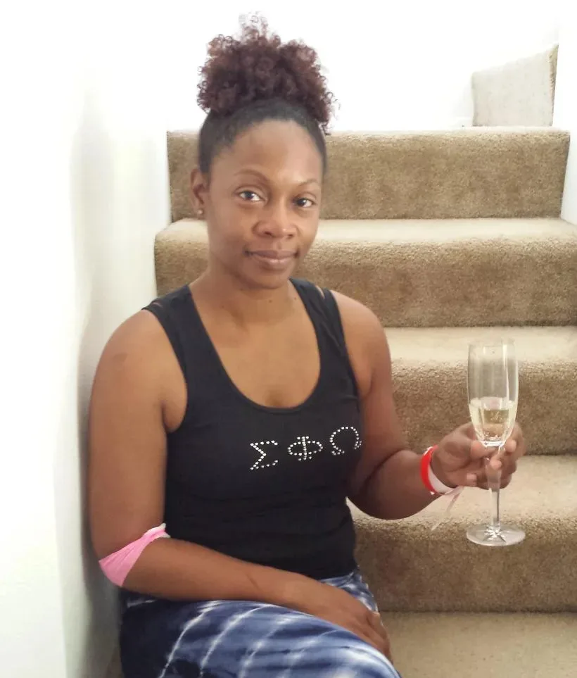 Kimberly with her champagne, celebrating “kicking cancer’s butt” after her diagnosis, July 24, 2015.