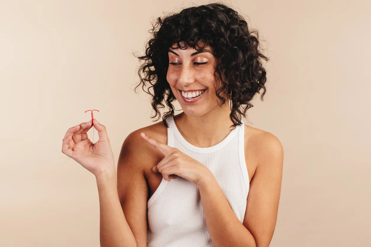 Cheerful woman choosing the copper IUD for contraception