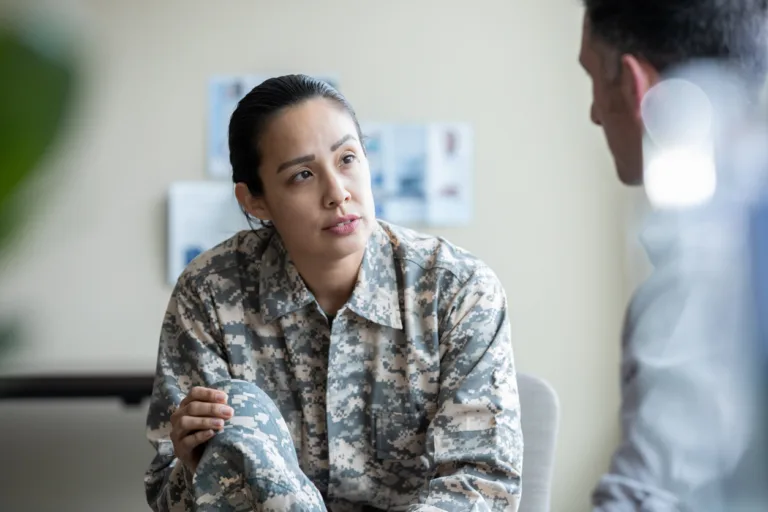 Adult military woman talking during one on one therapy session
