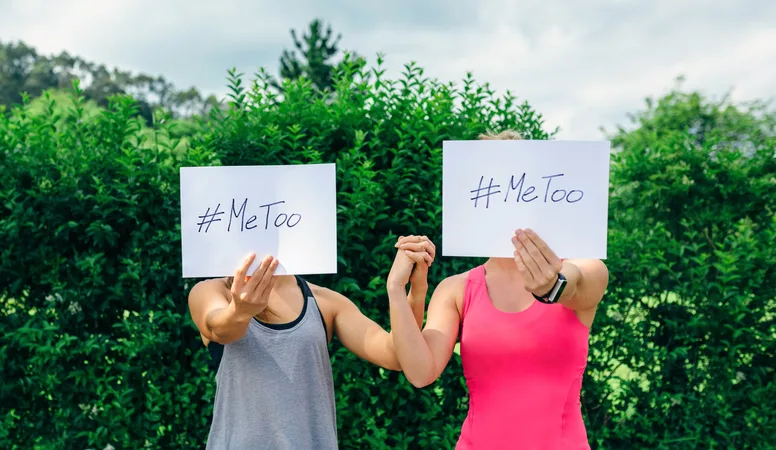 Women showing poster with metoo hashtag