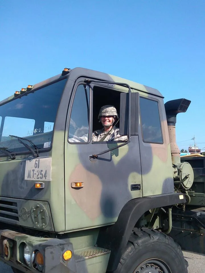 Amber in an army truck