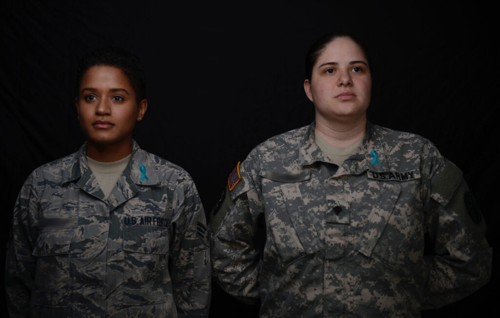 A U.S. Air Force Airman and a U.S. Army Soldier show support for sexual assault survivors at Joint Base Langley-Eustis, Va., March 28, 2017. April is Sexual Assault Awareness and Prevention Month, which highlights the resources provided for sexual assault survivors. (U.S. Air Force photo/Airman 1st Class Kaylee Dubois)
